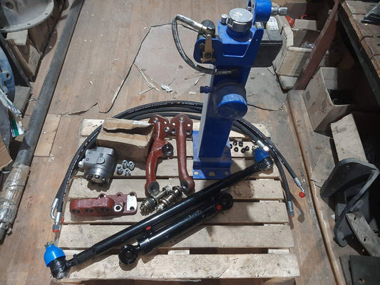 Переобладнення з встановлення дозатора з гідробаком з блокування та з кронштейном (під міст старого зразку під